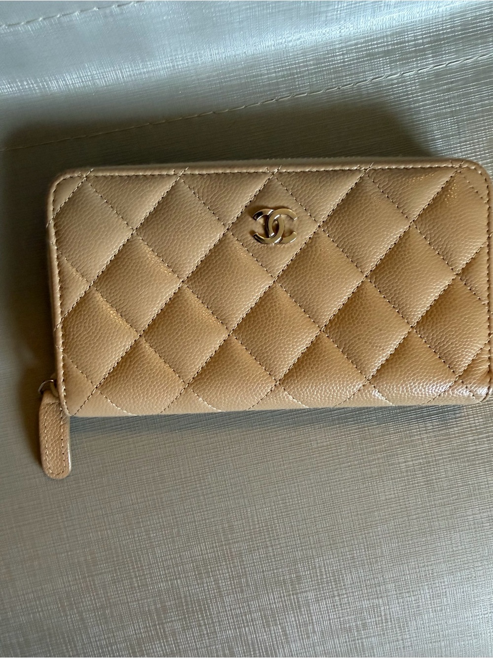 CHANEL Quilted medium size Zip-Around Wallet in Tan Beige with silver CC